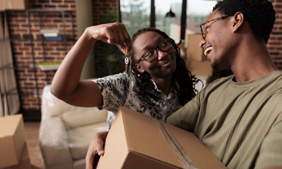 African american couple feeling happy about new property