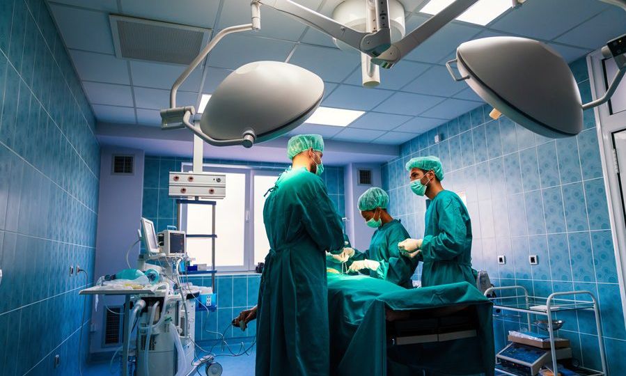 Surgery team operating in a surgical room