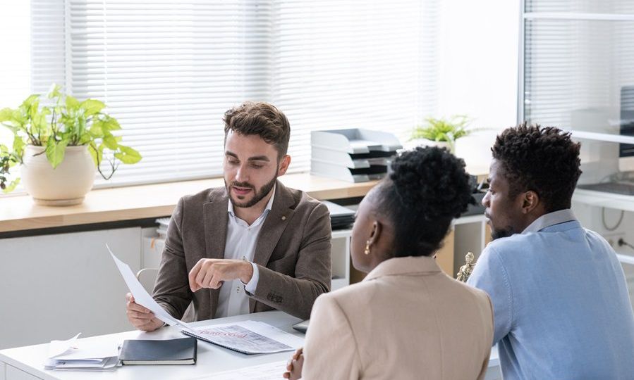 Lawyer Giving Consultation To Young Couple