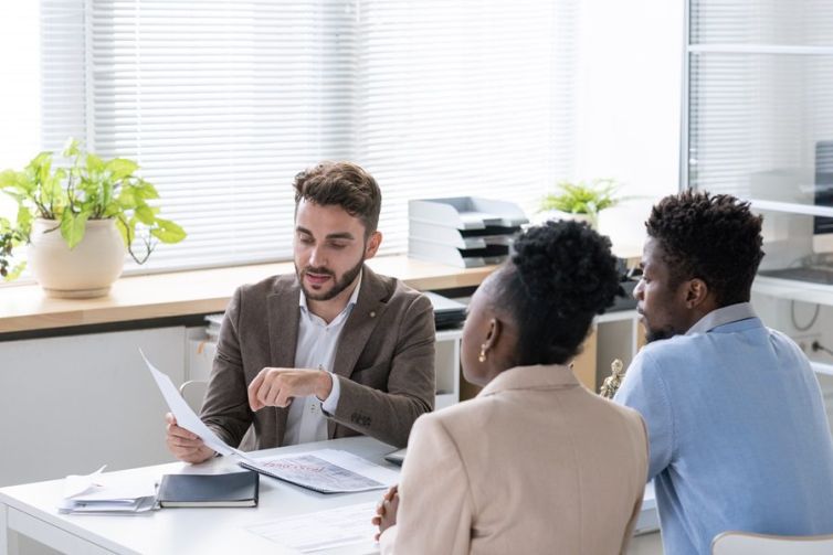 Lawyer Giving Consultation To Young Couple